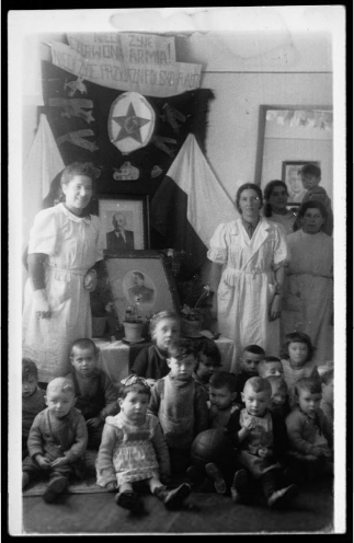 Children in a Jewish orphanage gathered for a celebration in honor of the Red Army, Pietrolesie, Lower Silesia, 1946. Portraits of Lenin and Stalin adorn the altar and the Polish banner reads, “Long Live the Red Army! Long Live Polish–Soviet Friendship!” (YIVO)