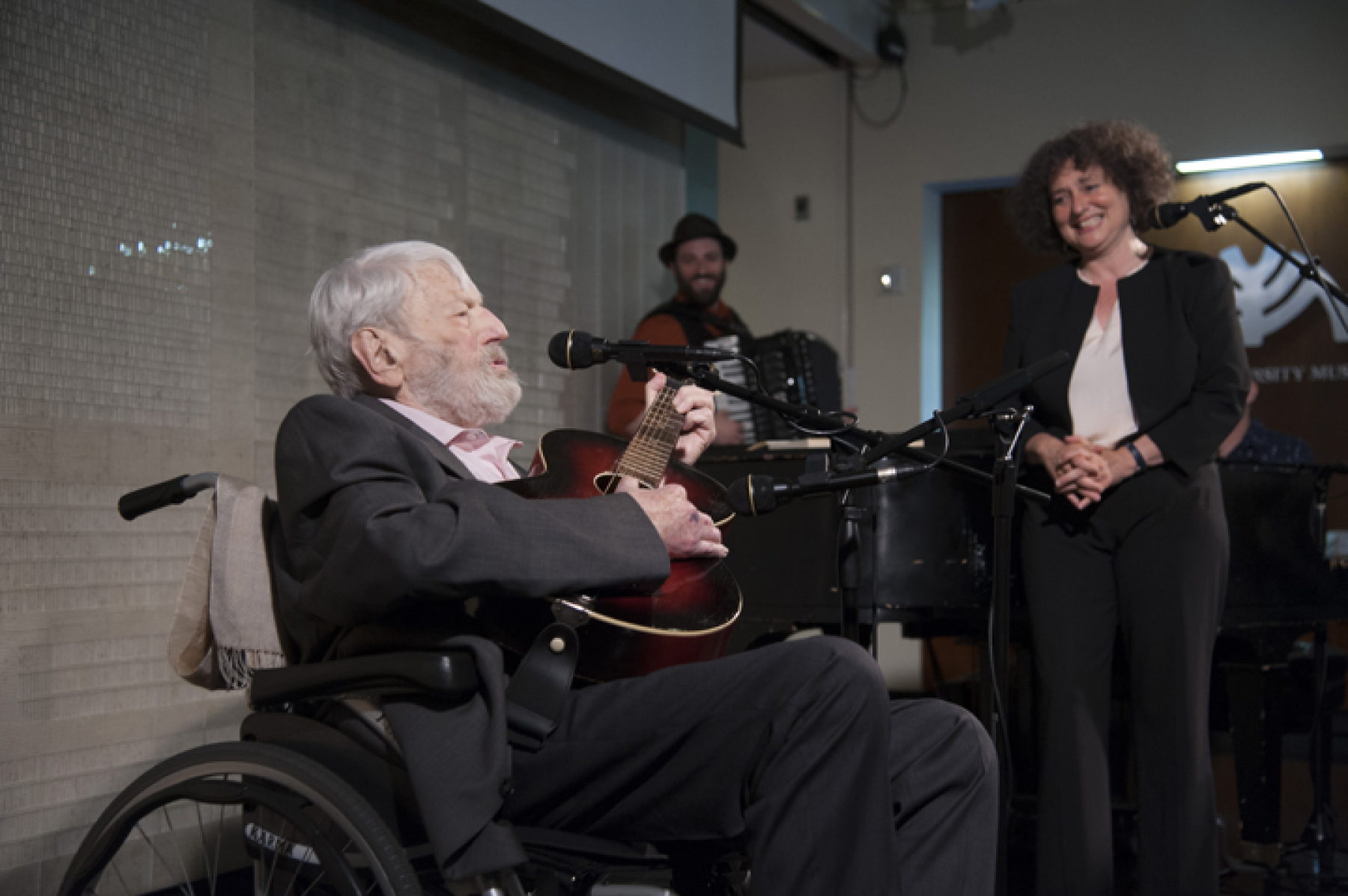 Theodore Bikel sings at the 13th Annual Heritage Luncheon (background: Daniel Kahn; Shura Lipovsky). Photo by Melanie Einzig.